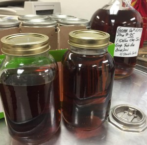 These jars and the jug behind represent bourbon a wife processed after buying it as a Christmas present for her husband. Some were later given as Christmas presents. She told investigators she thought the sale from one of the crime ring members was legitimate. Photo by Brad Bowman. 